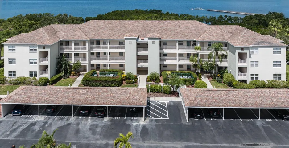 Front elevation with covered parking and guest parking