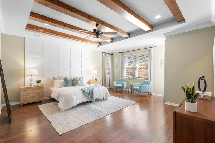 Wood beams & wood accent wall in primary