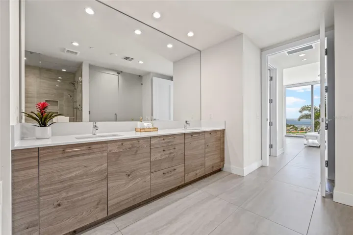 The primary bathroom offers plenty of storage and generous counter space, combining functionality with style.