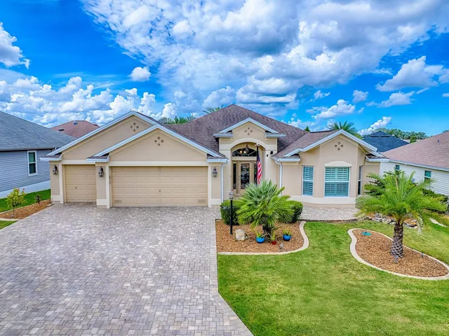 BOND PAID and TURNKEY! This stunning Designer Lily boasts a 2-Car with GOLF CART GARAGE in the Village of Tamarind Grove.