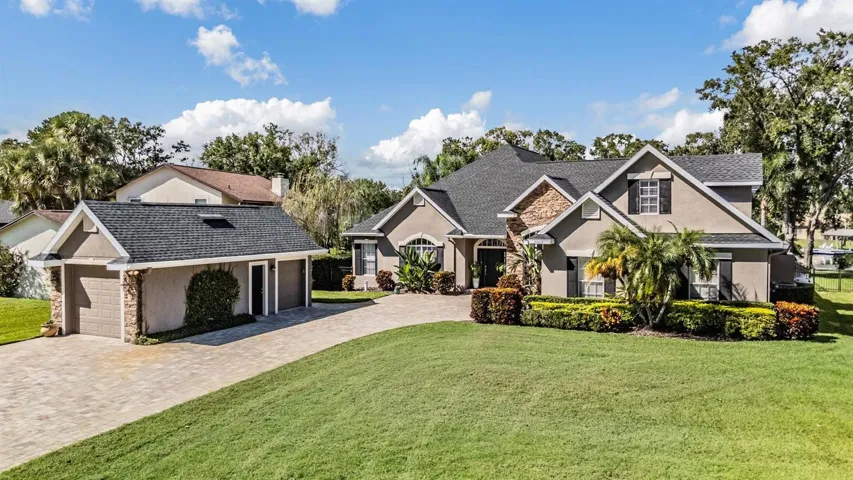 Detached garage with 9' door and golf cart garage!