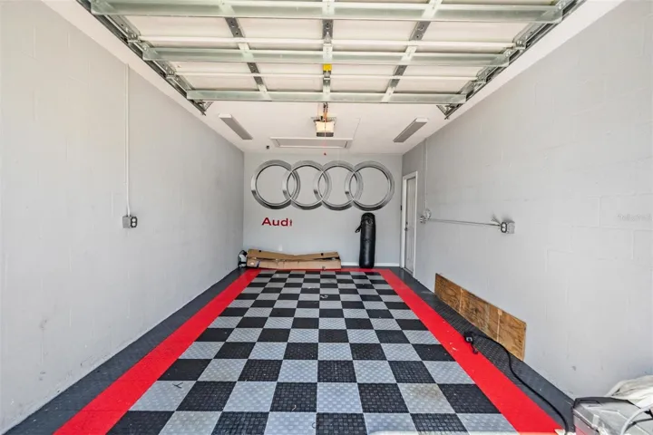 Detached Garage with 9' door, golf cart garage sits behind this garage with it's own separate door