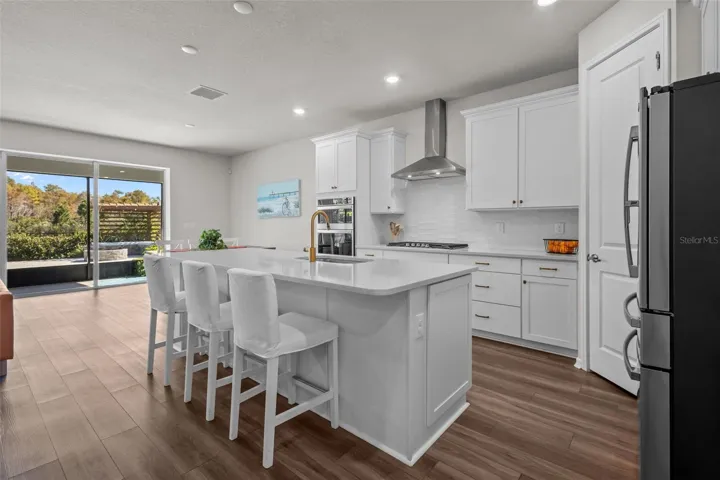 KitchenThe open-concept kitchen features built-in appliances, a natural gas cooktop, and a functional layout for everyday living.