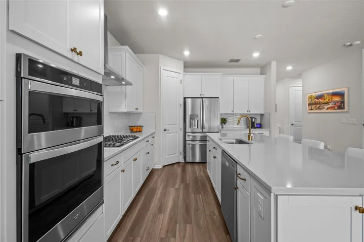 KitchenThe open-concept kitchen features built-in appliances, a natural gas cooktop, and a functional layout for everyday living.