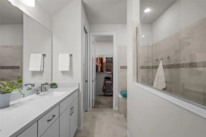 Primary bathroom with dual sinks and super shower