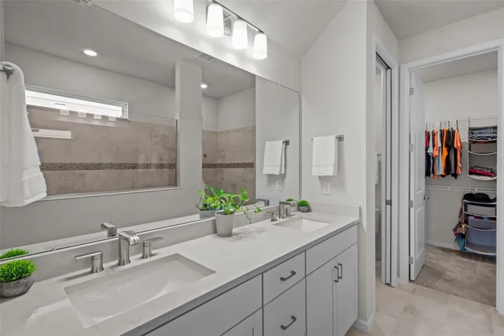 Primary BathroomSpa-like primary bathroom with dual vanities, a large shower, and a comfortable owner’s suite layout.