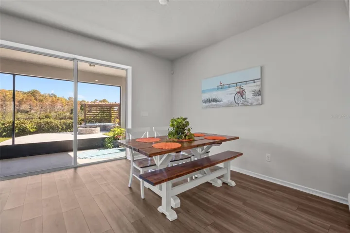Dining AreaSpacious dining area positioned between the kitchen, living room, and outdoor living space.