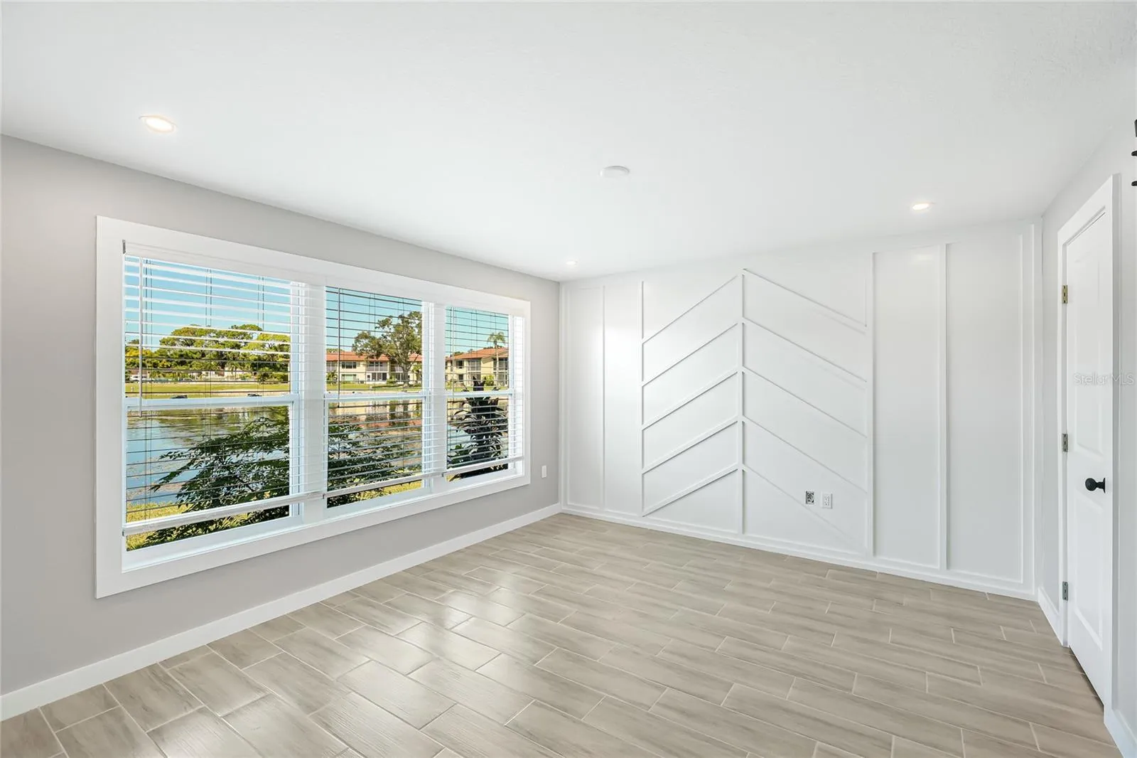 Primary Bedroom with feature wall.