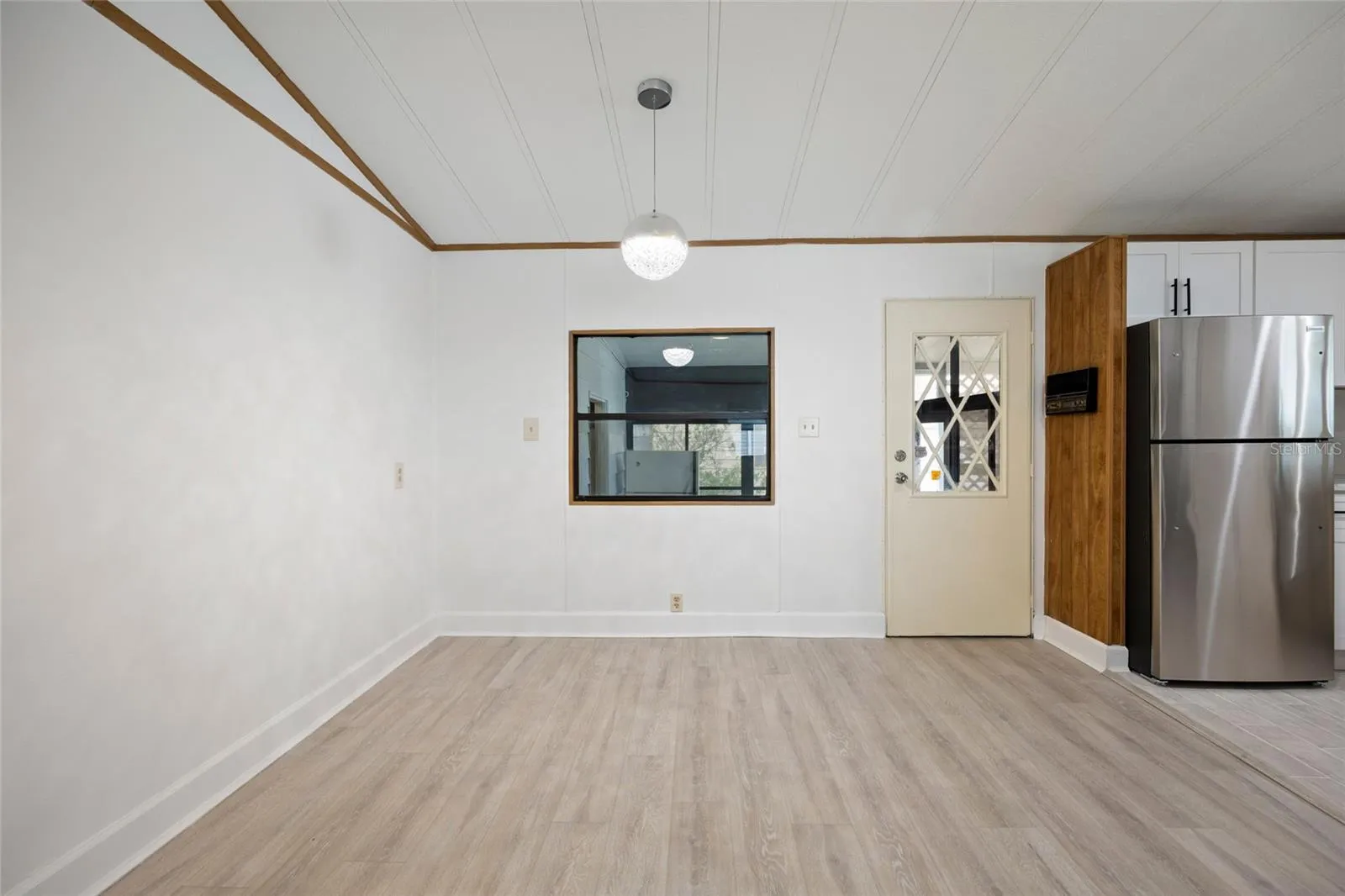 Dining Area With Open Access To The Kitchen &amp; A Door To The Hall Connecting Your Laundry Room And Carport