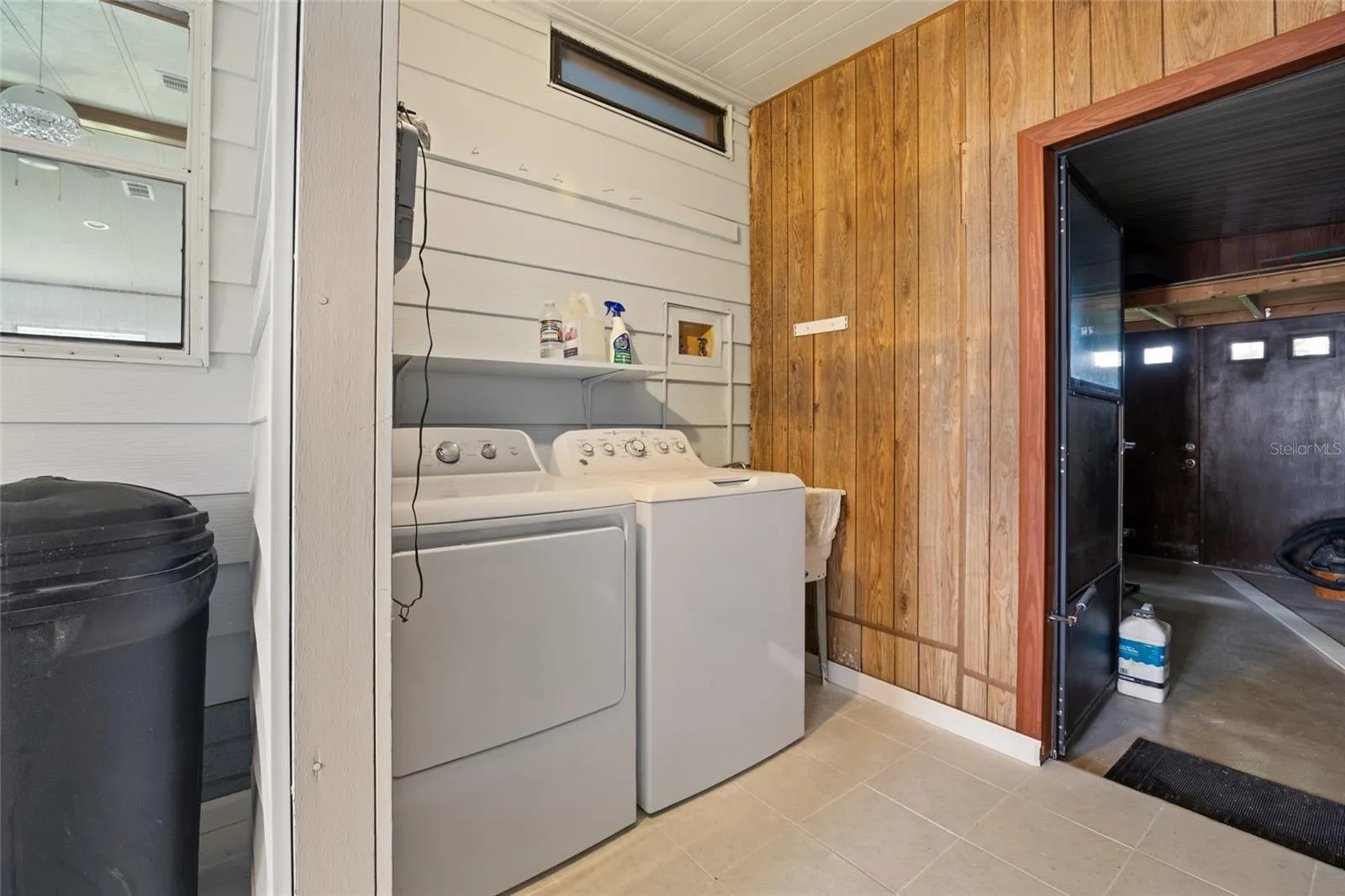 Tiled Laundry Room With A Utility Sink