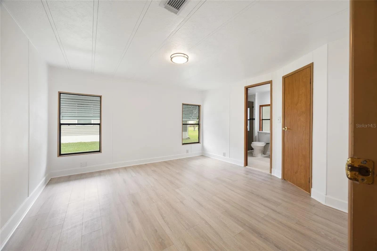 Large Master Bedroom With A Private Bathroom And Walk-In Closet