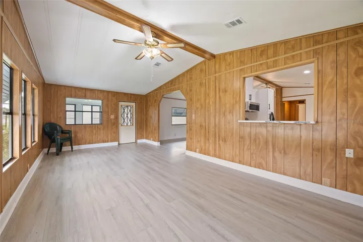 Another Look At The Living Room With A Pass-Through Window To The Newly Remodeled Kitchen &amp; A Door To Your Enclosed Lanai