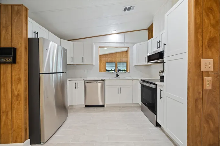 Newly Remodeled Titled Kitchen With Stylish Cabinetry