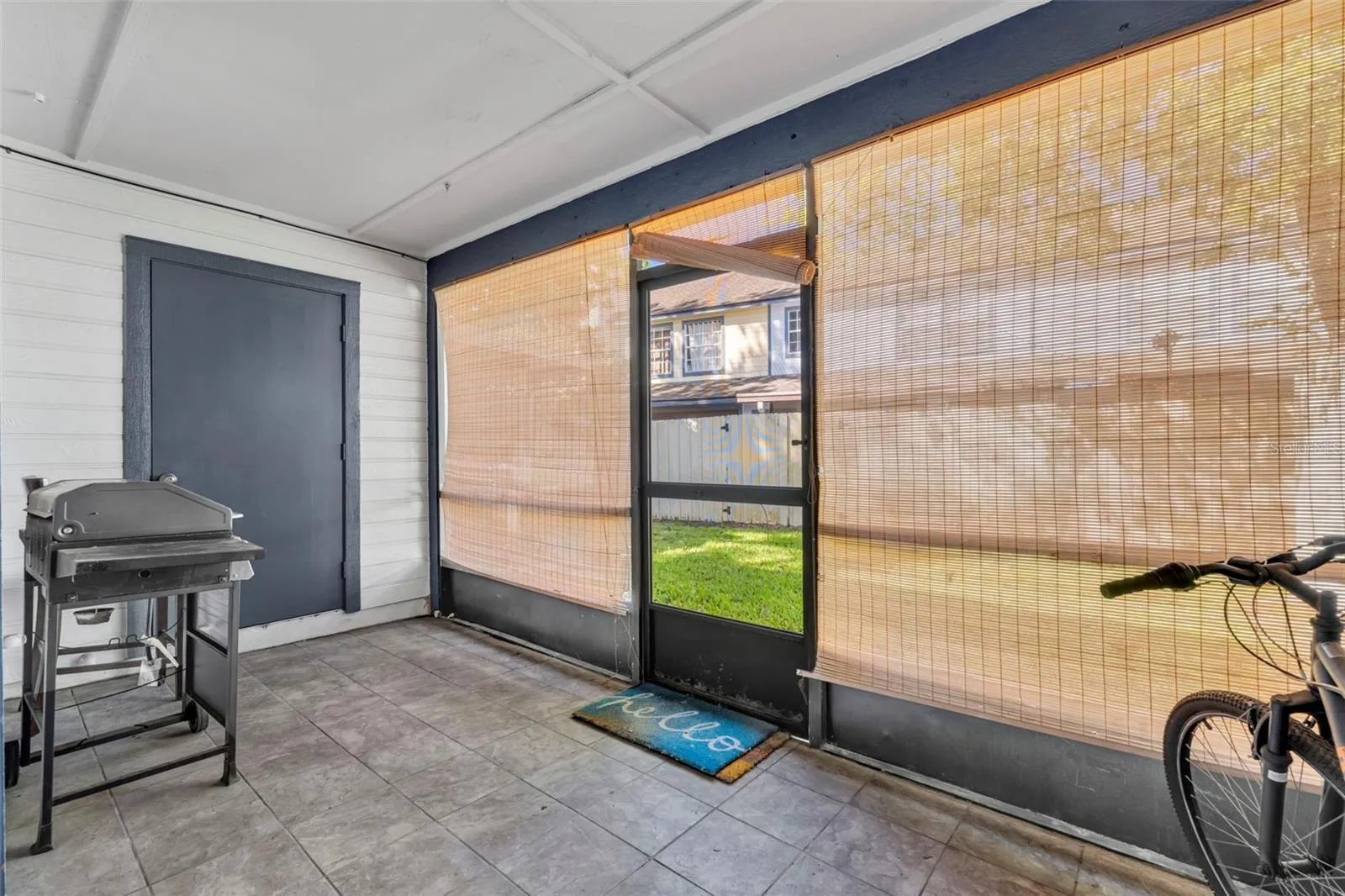 Screened in back porch with your private storage room.