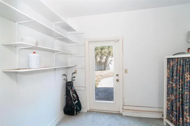 Extended garage with door to rear yard
