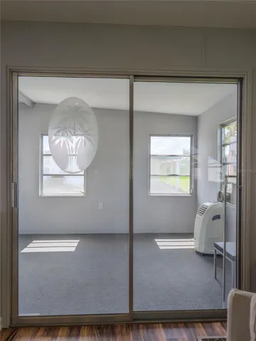 New carpet and fresh paint in enclosed porch