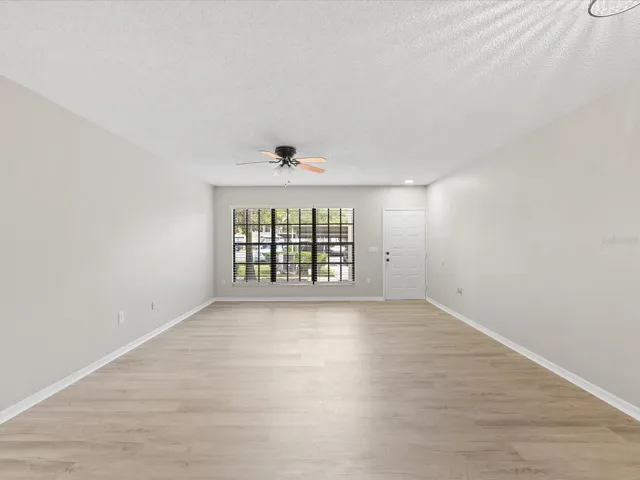 Freshly Painted Huge Living Room with BRAND NEW FLOORS and Levelor Blinds