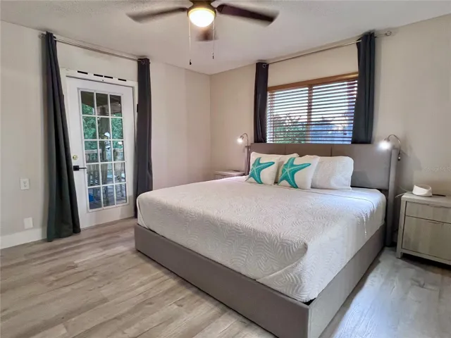 Primary bedroom, door leads to the covered back deck