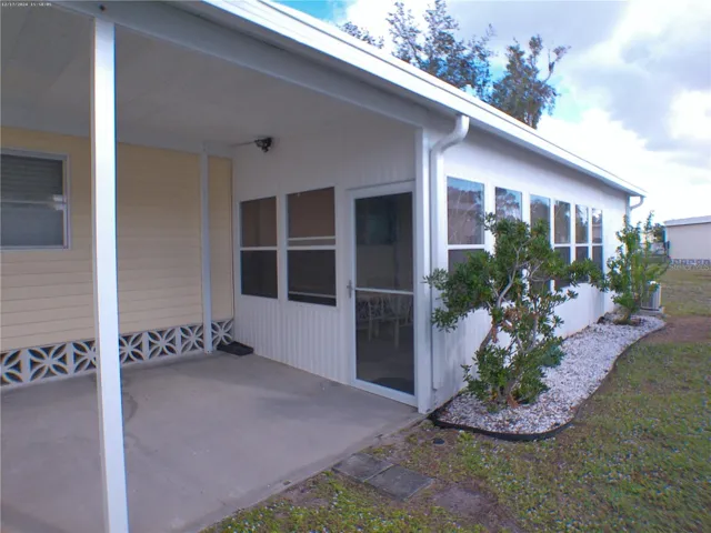 Carport Entrance to AC Patio, Workshop and Laundry room