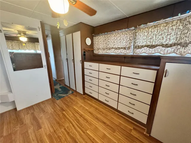 Bedroom with built in closets and dresser