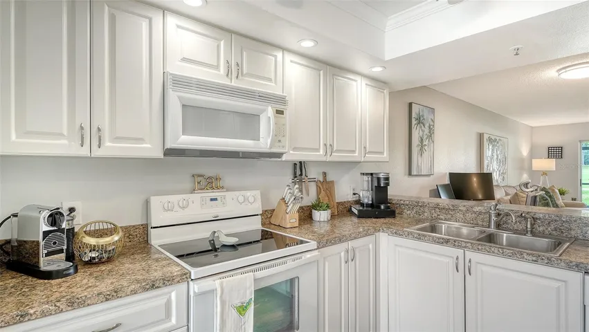 Bright White Kitchen Open to Living Space