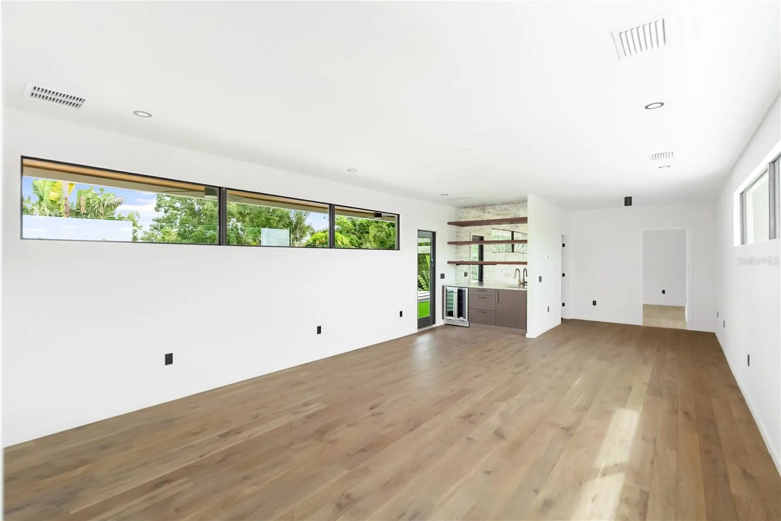 Second floor media room with access to private balcony