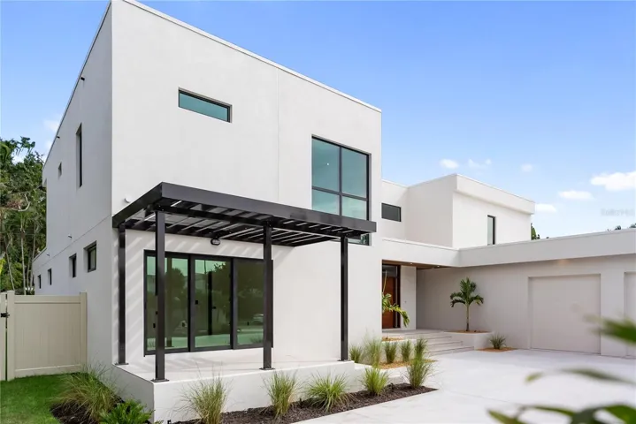 Front patio with elegant trellis detail and direct access to the office through sliding glass doors