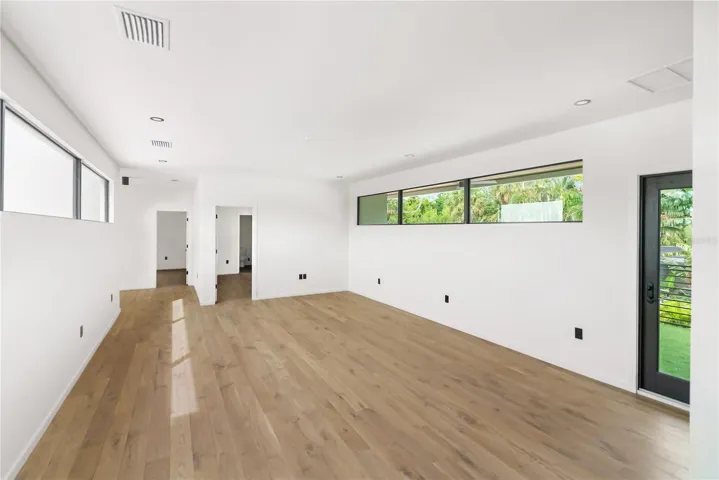 Second floor media room with access to private balcony