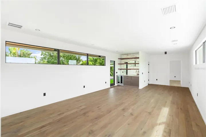Second floor media room with access to private balcony