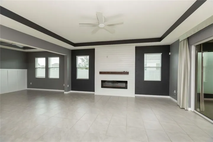 Beautiful Electric Fireplace. Sliders to Lanai