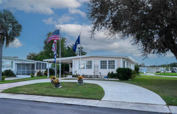 This home is situated on a corner lot with a circular driveway