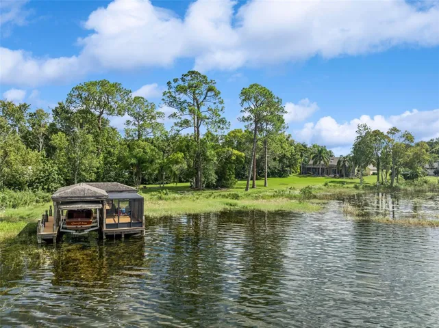 Boat house with electric cover and screened in room