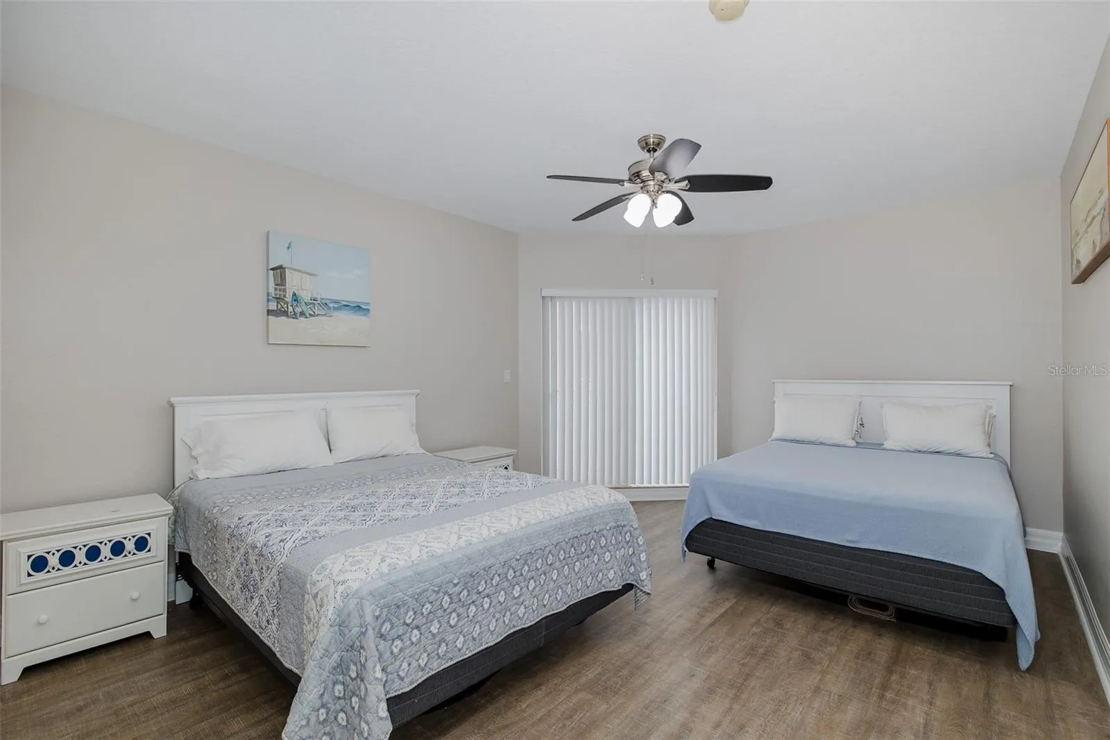 Guest bedroom with its own private balcony, offering separation for guests or rental use.