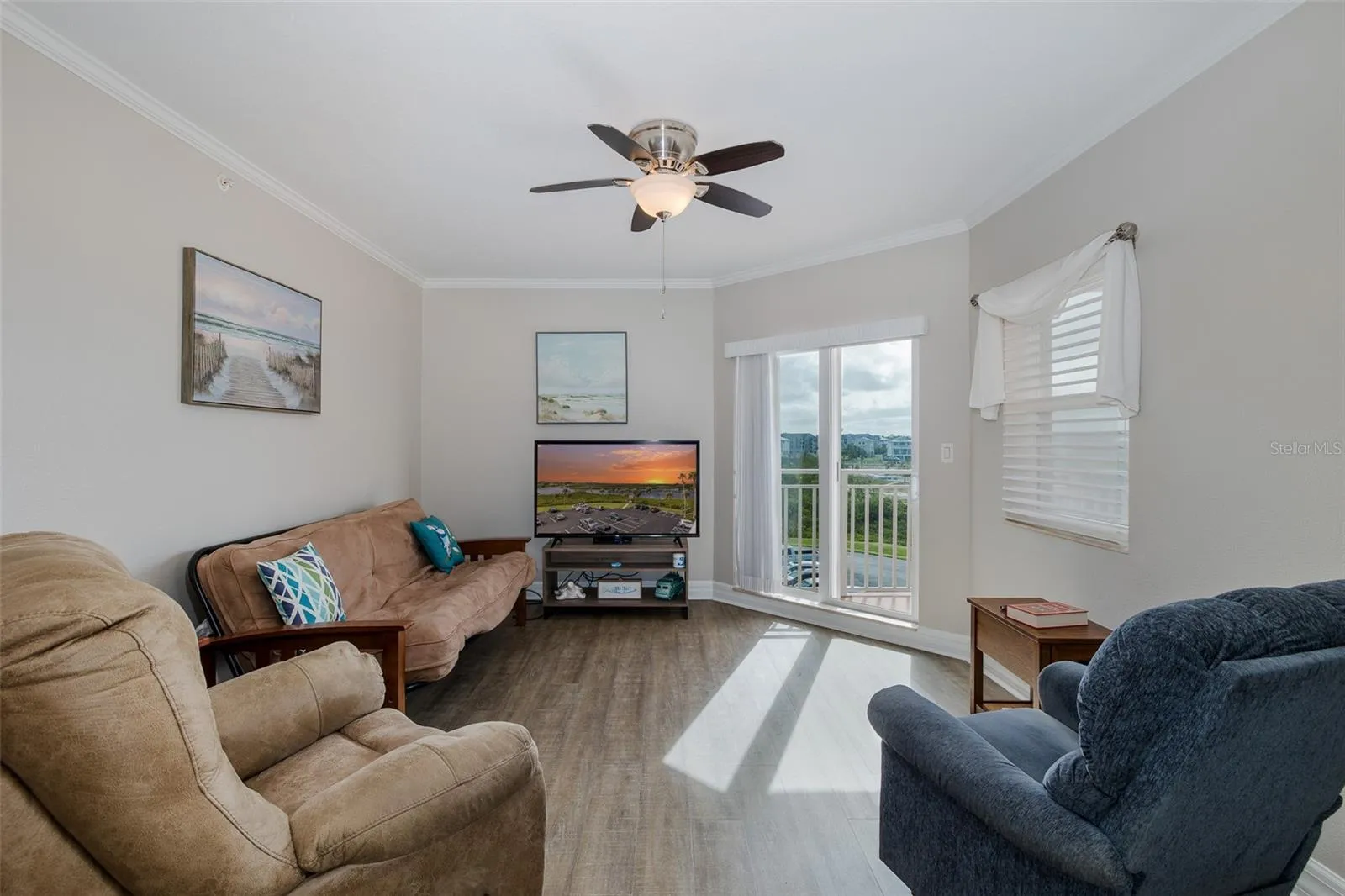 Fourth-floor living and dining area with high ceilings, natural light, and elevator access located steps from the front door.