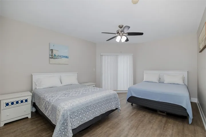 Guest bedroom with its own private balcony, offering separation for guests or rental use.
