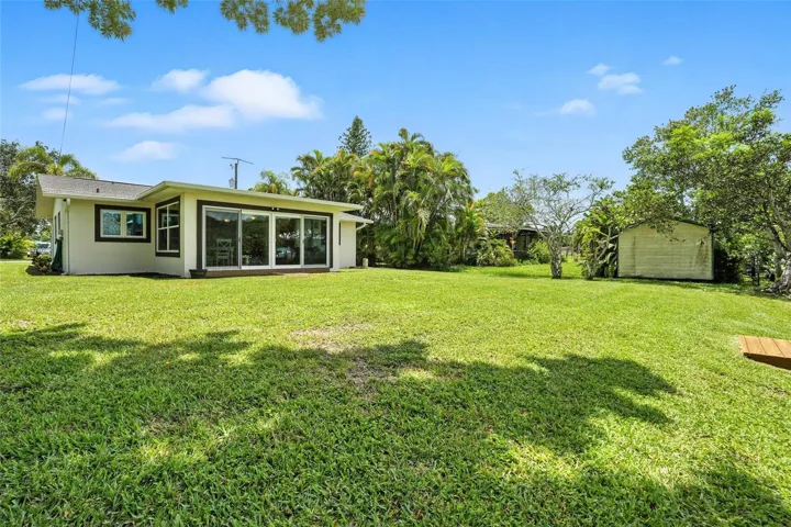Exterior of the home looking towards the water