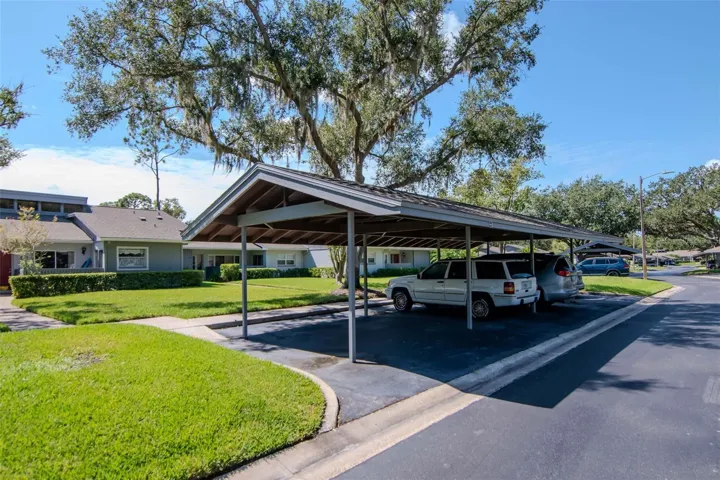 A dedicated car port with additional open parking