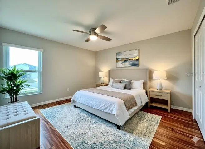 Spacious fourth bedroom with luxury vinyl flooring and natural light — flexibility for family or hobbies.