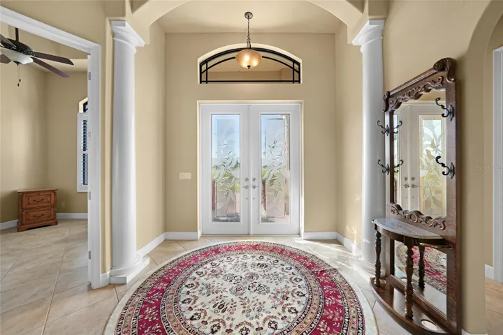 Lavish foyer with 8' double entrance doors.