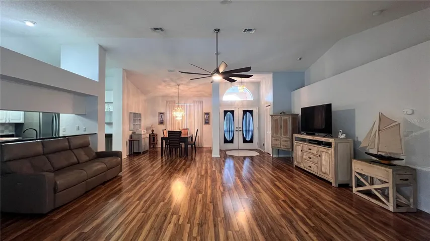 Great room front entrance doors and dining room on the left