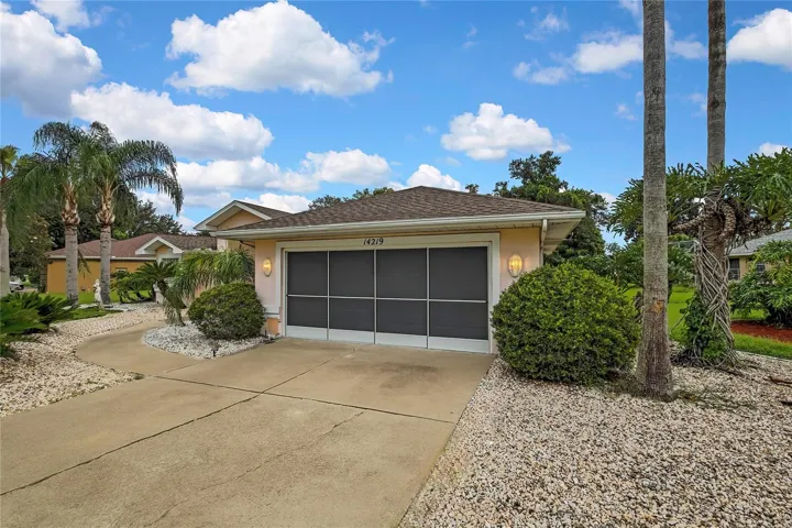 Oversized 2 car garage features screened doors