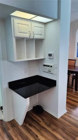 Built in desk in corner of the kitchen.  Home music center on right wall of desk controls ceiling speakers in great room and pool lanai covered area.