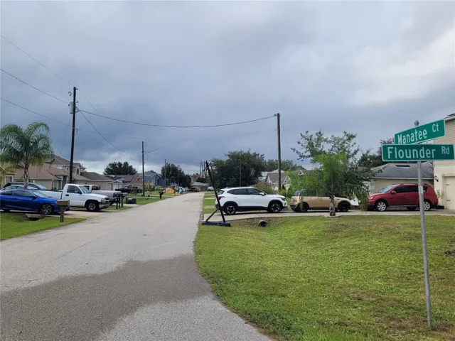 View of property from intersection. Lot situated on rear right.