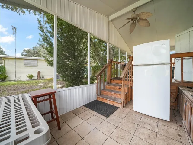 Lower level screened porch with ceramic tile floor