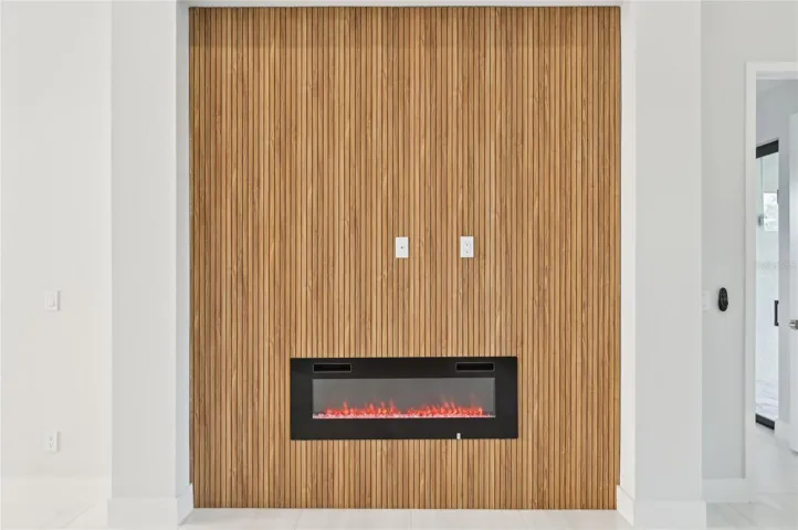 Fireplace with wood slatted accent wall