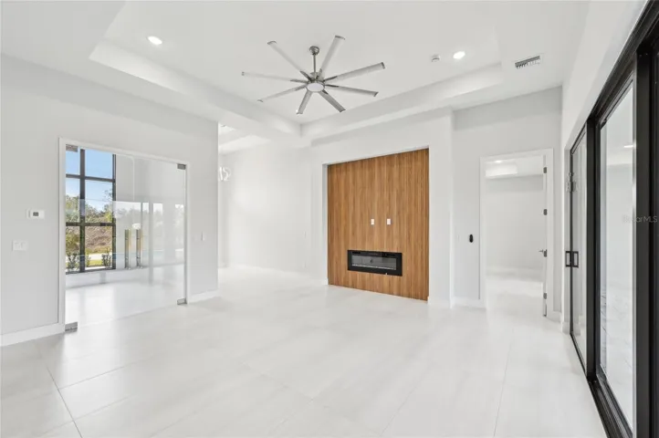 Living Room with glass-doored office or dining room