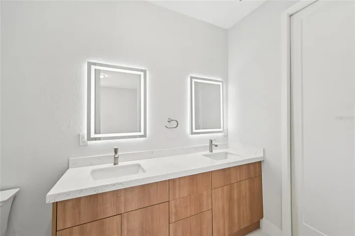 Junior Primary's Dual sink vanity and walk-in closet