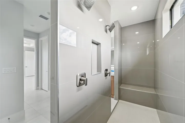 Primary's shower with dual shower heads