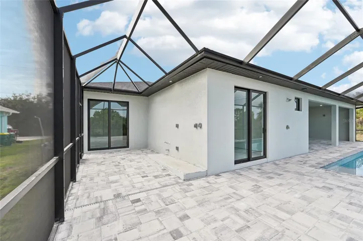 Incredible wrap-around pool deck that gives Junior Primary Suite some privacy and also is where the Summer Kitchen is plumbed.