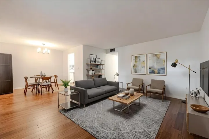 This spacious living and dining area offers an open, inviting layout with beautiful bamboo floors that flow seamlessly throughout the space.